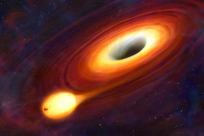 Czarna dziura jest obiektem tak zwartym, że nic nie może uciec jej przyciąganiu grawitacyjnemu. Nawet światła. Na Ziemi obiekt musi zostać wystrzelony z prędkością 11 km / s, jeśli ma uciec grawitacji planety i wejść na orbitę. Ale prędkość ucieczki czarnej dziury przekracza prędkość światła. Ponieważ nic nie może podróżować szybciej niż ta maksymalna prędkość, czarne dziury zasysają wszystko, w tym światło, co czyni je całkowicie ciemnymi i niewidocznymi. Na tym zdjęciu widzimy czarną dziurę, ale tylko dlatego, że jest ona otoczona przegrzanym dyskiem materiału, dyskiem akrecyjnym. Im bliżej otworu jest materiał, tym więcej światła jest wychwytywane, dlatego dziura ciemnieje w kierunku jej środka.