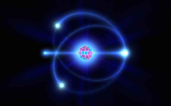 Elektrony to cząstki o ładunku ujemnym, które krążą wokół jądra atomowego.